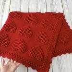 Hand-knitted baby blanket with heart pattern, red and embossed 💕