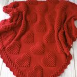 Hand-knitted baby blanket with heart pattern, red and embossed 💕