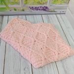 Patterned baby blanket made with knitted and plush (puffy) yarn