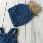 Hand-knitted baby romper and hat set. Embossed and bud-patterned.